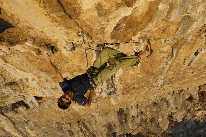 Ruben posing climbing Vizija (8c) on the Slovenian limestone of Mišja Peč © Firnenburg Archive